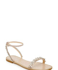 Side view of Kensy Flat Sandal For Women In Champagne With Ornate Embellishment And Breathable Leather Lining Easy Slip On Comfort Sandal.