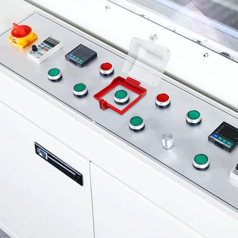 Control panel with big transparent emergency stop button cover with removable base box type push switch protector in industrial setting.