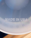 Close-up of label 'Made in USA' on One Gallon 128oz Pitcher With Handy Conversion Chart Built Tough Food Grade Plastic BPA Free