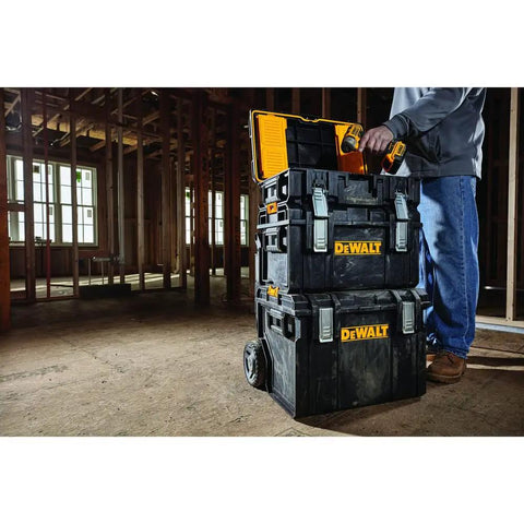 Person using Rugged ToughSystem Tool Box With Pull Back Lid For Maximum Storage Non Detachable Lid Wide Grip Handle