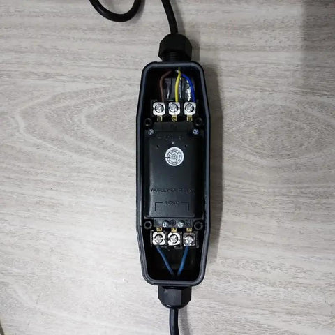 Inline GFCI Leak Protector waterproof outdoor extension cord adapter showing internal wiring and weatherproof housing.