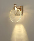 Crystal Bubble Wall Sconce LED Light In Nordic Gold Finish with glowing glass bubble shade on wall