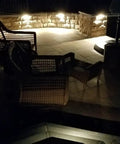 Outdoor patio lit by Three LED Landscape Lights With Bracket In Textured Architectural Bronze Finish 4 Pack For Outdoor Pathway