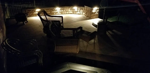 Outdoor patio lit by Three LED Landscape Lights With Bracket In Textured Architectural Bronze Finish 4 Pack For Outdoor Pathway