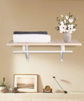 Totally Legit Closet Rod And Shelf Brackets Size 11 By 9.5 Inch Steel Wall Mount supports towels on a shelf with floral decor.