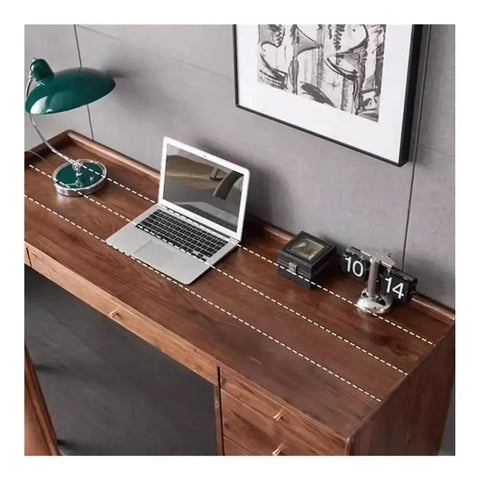 Ergonomic Adjustable Standing Desk Featuring Rich Walnut Desktop Four Deep Storage Drawers Integrated Monitor Stand view from above with laptop and lamp
