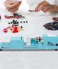 Mini Metal Wood Lathe Machine Corded Electric Compact Desktop Milling Tool For Small-Leaf Rosewood Craft Projects on workbench.