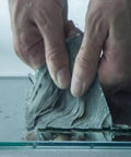Hands applying 2 Pack Butyl Rubber Aluminum Foil Sealant Tape 5cm By 5m Weatherproof Waterproof Leak Repair on surface