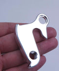 Hand holding Derailleur Hanger 43 GH002 Replacement For Nishiki Back Roads Colorado Raleigh F500 CNC Alloy Silver Dropout