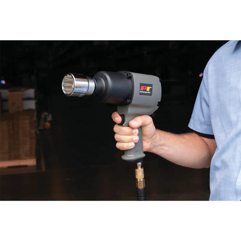 Person holding M627 3 Quarter Inch Drive Heavy Duty Impact Wrench With Aluminum Housing Delivers Up To 950 Foot Pounds Of Torque