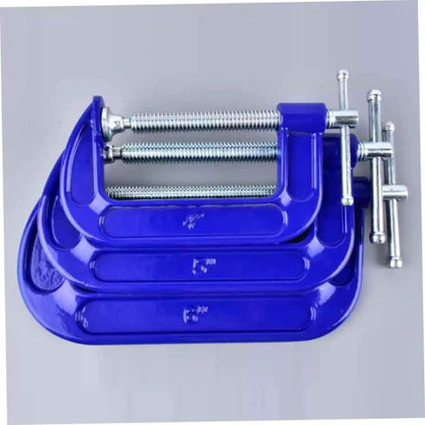 Set of three blue G clamps in varying sizes, designed for woodworking and crafting. Built Tough 4 Inch Woodworking G Clamp With Quick Release C Clamp For Desk Mounting Universal Tabletop Clamp For Woodworking Crafting Projects Featuring A Swiveling Pad With Ball And Socket Joint Delivers Even Pressure On Workpieces.