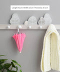 Wall Mounted Rustic Wood Coat Rack With Dope Key Storage Hooks Keeps Your Gear Neat, displays a pink umbrella and white scarf.