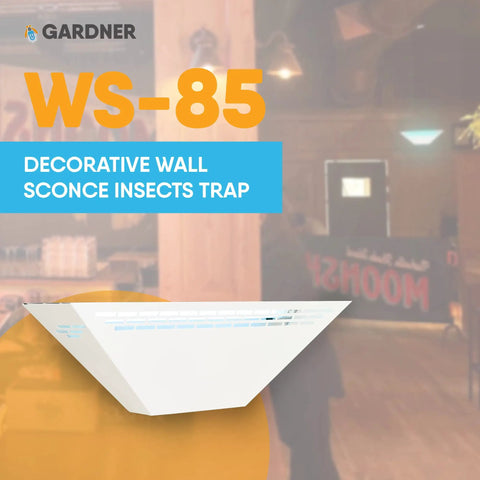 Lowkey White Wall Sconce Fly Light Trap With Shatterproof UV Lamp displayed in a restaurant setting.