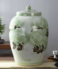 Slay Your Pantry Game With This Knockout Green Ceramic Rice Jar Featuring Hella Secure Airtight Lid Perfect For Stashing Cereals Grains Coffee Or Tea Straight Up Classic Decor. Green ceramic rice jar with floral design, airtight lid, ideal for food storage.