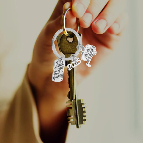 Travel Themed Zinc Alloy Keychain For Adventurers And RV Lovers with silver charms and keys in hand