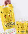 30 Pack Cartoon Theme Party Gift Bags With Easy Carry Top Handles, 10 inch by 7 inch, featuring Pikachu design, yellow color.