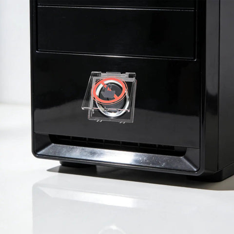 Clear Power Button Guard For PCs And Home Appliances on black computer tower. Dustproof switch protector stopping accidental presses, 43x41mm.