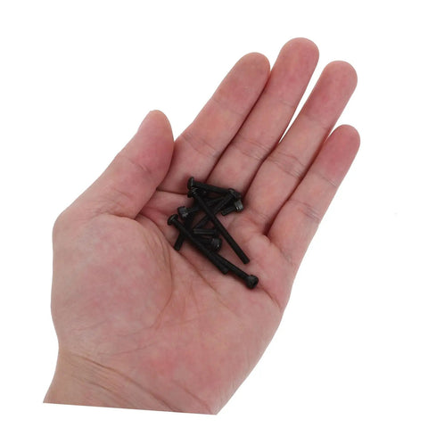 Hand holding metric socket head cap screws from the Shop Grade Metric Socket Head Cap Screw Assortment Kit With 1600 Pieces.