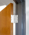Top Shelf White Steel Door Hinges 9 Pack, 4 1/2 X 4 1/2 With 5/8 Rounded Corners installed on a wooden door.