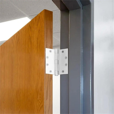 Heavy Duty Stainless Steel Door Hinges Slick White Finish 4 1/2 Inch With 5 8 Radius and smooth swinging action on a wooden door.