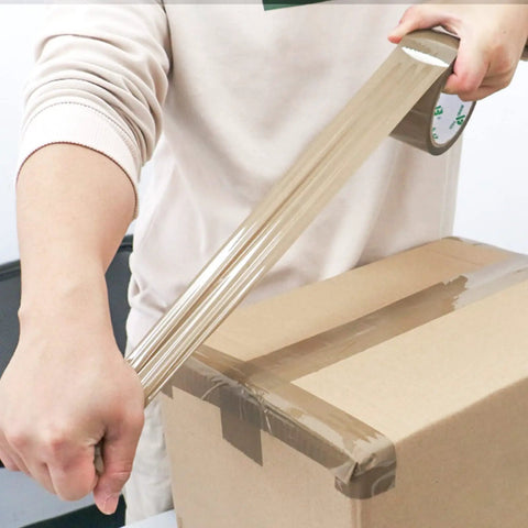 Person using Brown Packing Tape With Dispenser 2.4 Mil Thick 1.88 Inch Wide By 60 Yards 6 Rolls Total Free Dispenser Included