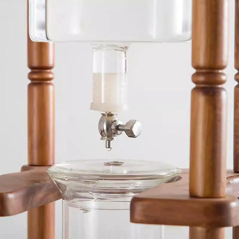 Close-up of the Badass Cold Brew Drip Tower Holds 25 Cups With Solid Wood Base, Slow Drip Ice Coffee Maker faucet.
