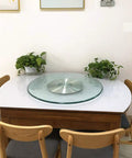 Heavy Duty Tempered Glass Lazy Susan Turntable With Non Slip Rubber Feet, 8mm Thick Clear Rotating Serving Plate, placed on dining table