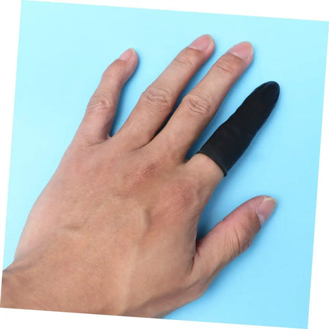 1000 Piece Black Latex Finger Sleeves Block Sneaky Sweat Smudges And Greasy Fingerprints From Messing With Pristine Hardware For Tough Shop Floor Crews And Weekend Gearheads Fixing Tight Builds on a hand.