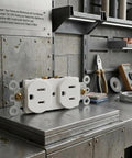 Top Tier Sturdy Heavy Duty 15A 125V Dual Wall Outlet Socket Compatible With Nema 5 15R on a metal workbench in a shop setting.