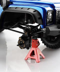 Beefed Up Brass Front And Rear Portal Housings For 1/10 TRX4 TRX6 RC Crawler installed on blue RC vehicle, adds 46g per side
