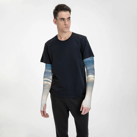 Ice Silk Arm Sleeves For Outdoor Comfort With Moisture Wicking Breathable Fabric Full Length Thumb Hole Sleeve Custom Pattern Sailing Sunset Scene Tranquil Sea And Cloudy Sky Ideal For Hiking Cycling Running on model