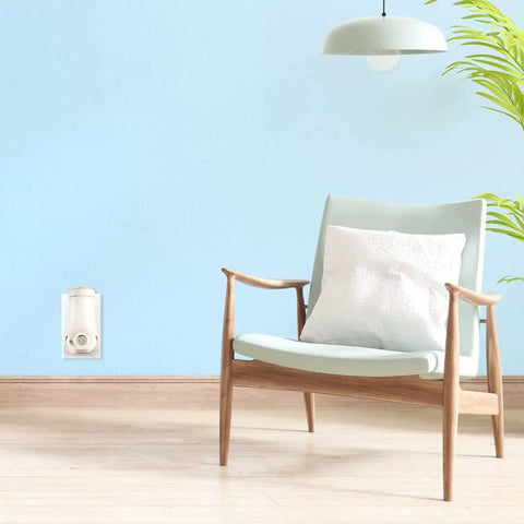 Living room with PlugIns Air Freshener Starter Kit With Two Fragrance Oil Warmers And Six Refills In Clean Linen Scent on wall outlet