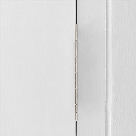 Close-up of a heavy duty piano hinge set for wooden boxes and jewelry boxes, installed on a cabinet door.