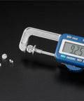 Jewelry-Making Digital Caliper,25mm Range,0.01mm Precision Thickness Gauge measuring a diamond at 9.25mm with smaller diamonds beside.