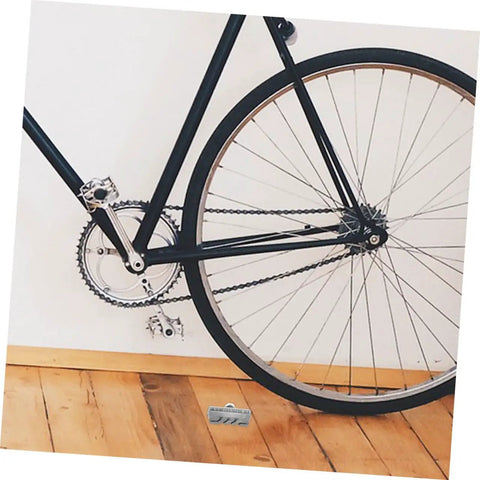 Rock Solid Rear Disc Brake Pads For Mechanical Road And Gravel Bikes Easy Swap Design on a black bike with gear system.