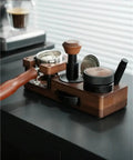 Smooth Operator Wood Espresso Tamper Station fits 51 and 58 mm baskets, showcasing wood craftsmanship on a black countertop.