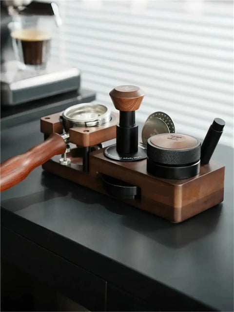 Smooth Operator Wood Espresso Tamper Station fits 51 and 58 mm baskets, showcasing wood craftsmanship on a black countertop.