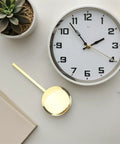 Gold metal pendulum next to wall clock, Metal Pendulum Clock Replacement Part, 5.90 Inch Wall Clock Accessory, DIY Repair Tool