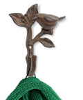 Heavy Duty Cast Iron Bird On a Branch Wall Hook With Screws Included For Real Deal Rustic Home Decor And Darn Smooth Hanging Organization You Will Love, displaying a green towel.