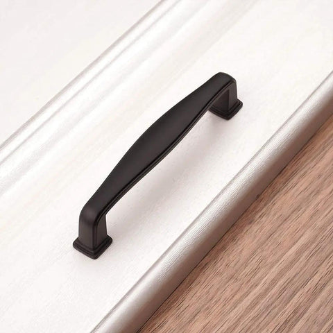 Grab These Sick Matte Black Cabinet Pulls Perfect For Any Renovation Vibe 10 Pack Of Rock Solid Drawer Handles with smooth, rounded edges on a cabinet.