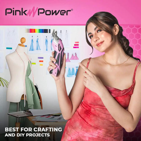 Pink Power Electric Fabric Scissors Box Cutter For Crafts Sewing Cardboard Carpet Scrapbooking Heavy Duty Professional Cordless Cutting Tool With Lithium Battery Charging Station And Storage Case Best Snip held by a woman, showcasing its use in crafting.