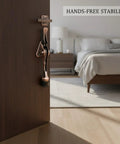 Foot Activated Door Stop With Weighted Zinc Alloy Base for hands free entry, visible on bedroom door with copper finish