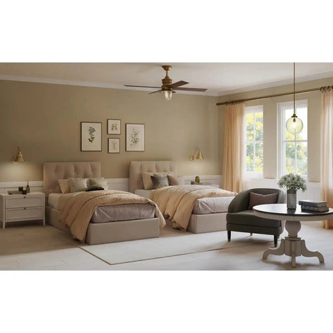 Bedroom with dual beds, beige bedding, art on walls, and a clear glass farmhouse pendant light in natural brass illuminating the room.