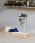 Sturdy Mini Bench Drill Press For Woodworking And Metal Crafting, compact size, drilling into wood, ergonomic design in workshop setting.