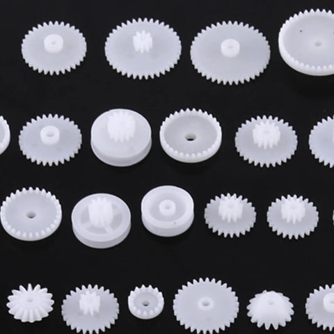 Durable Plastic Gear Kit Set For DIY Robots Cars And Tech Projects Includes 64 Wearable Crown Pulley Belt Gears Built Tough For Long Service Life Perfect For Creative Model Building And Mechanic Hobbyist Gadgets white ABS gears on black background