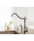 Single Handle Kitchen Faucet With Side Sprayer in Satin Nickel Finish, Victorian Style 2 Hole Mount, Brass Construction on counter