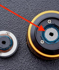 Close-up of fishing reel gears with Black Fishing Reel Grease 2 Oz For Smooth Casting And Maintenance applied to moving parts.
