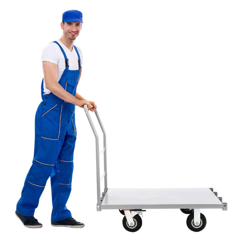 Heavy Duty Platform Truck Cart With Rock Solid Steel Deck And Smooth Roll Casters Built To Shift Two Thousand Pounds Like A Pro Warehouse Workhorse For Daily Hauling Tasks, showcased with a man in blue overalls.