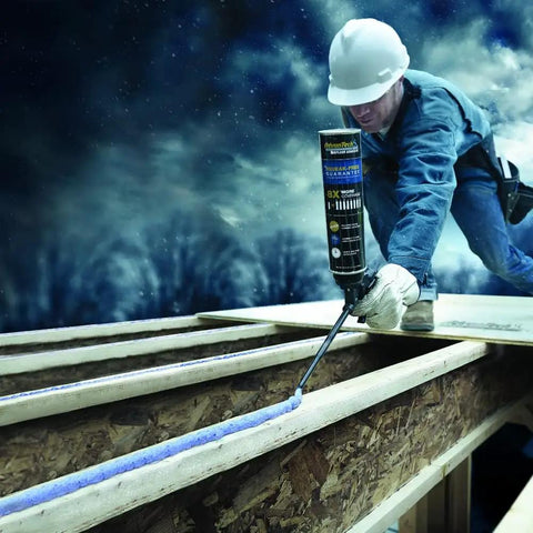 Worker applying adhesive with a Non Stick Foam Applicator Gun With PTFE Coating For Subfloor Adhesive Application Top Notch Pro Grade Spray Foam Gun That Delivers Controlled Adhesive Placement And Easy Cleanup On Wet Or Dry Surfaces