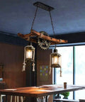 Retro Wood Pendant Lighting Fixture With Glass Shade And Black Metal Cage Frame in a cafe setting, E27 base.